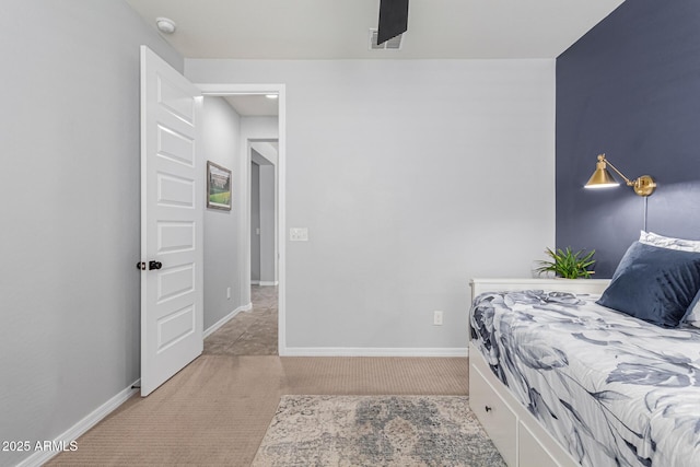 bedroom featuring light colored carpet