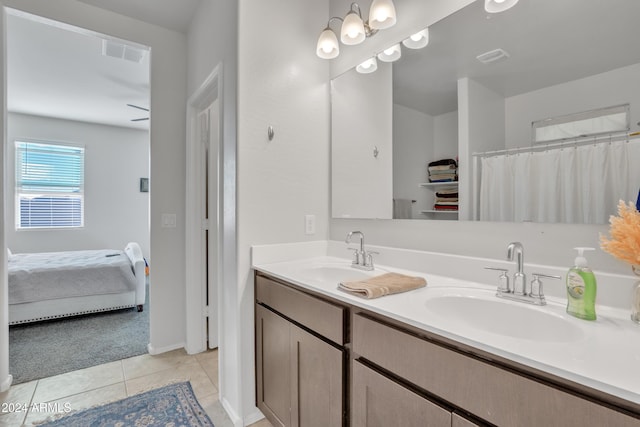 full bath featuring double vanity, tile patterned flooring, a sink, and visible vents