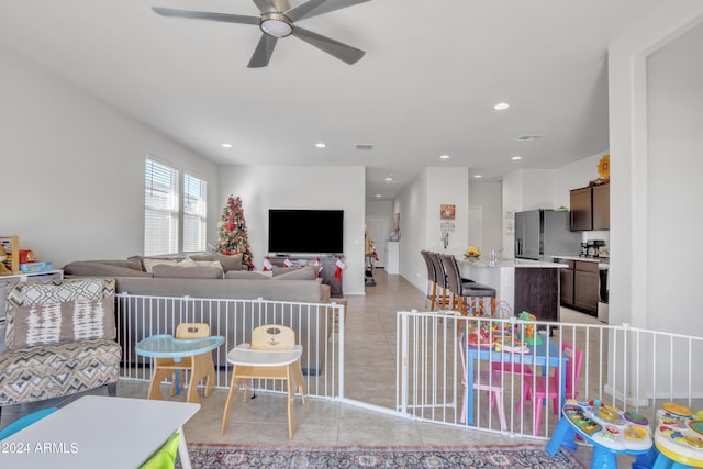 living area featuring a ceiling fan, recessed lighting, light tile patterned flooring, and visible vents