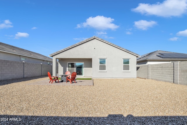 rear view of house with a patio