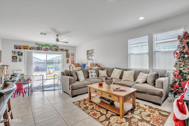 living room featuring a ceiling fan, recessed lighting, visible vents, and light tile patterned floors