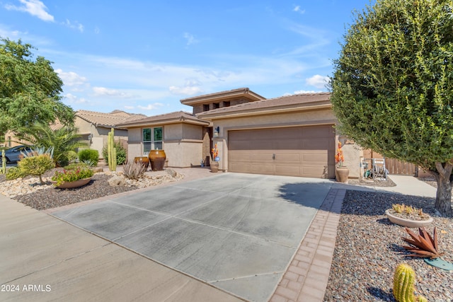 prairie-style house featuring a garage