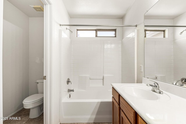bathroom with vanity, toilet, bathing tub / shower combination, and visible vents