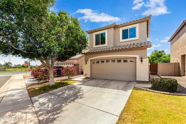 mediterranean / spanish-style house featuring a tile roof, a garage, fence, concrete driveway, and stucco siding