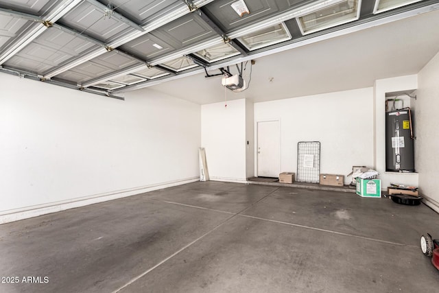 garage with a garage door opener and electric water heater