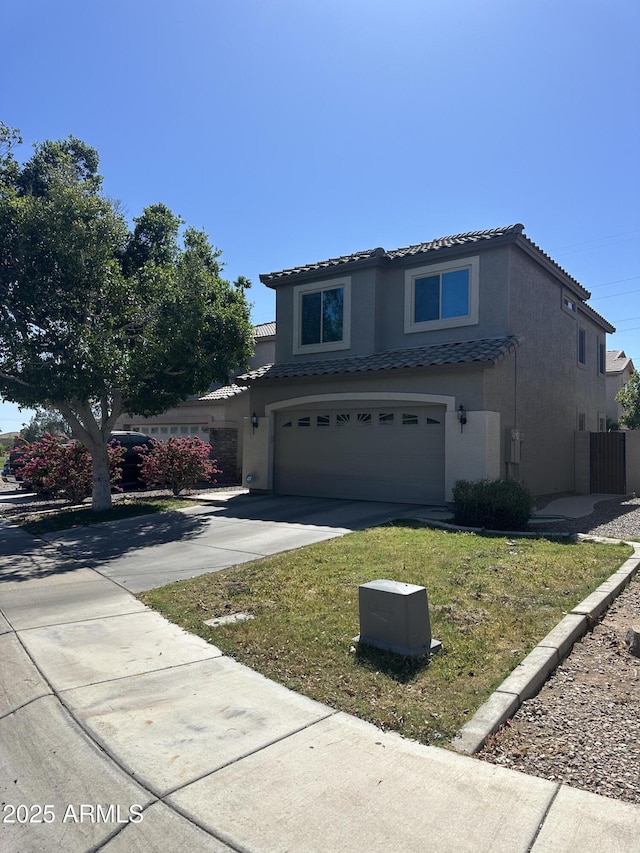 traditional home featuring a garage, stucco siding, concrete driveway, and a tile roof