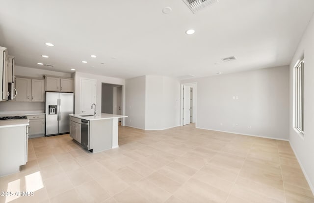 26995 W Adam Ave, Buckeye, AZ 85396 - kitchen featuring appliances with stainless steel finishes, a sink, light countertops, recessed lighting, and gray cabinetry