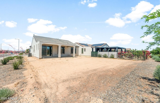 26995 W Adam Ave, Buckeye, AZ 85396 - rear view of house with central AC, stucco siding, and a tiled roof