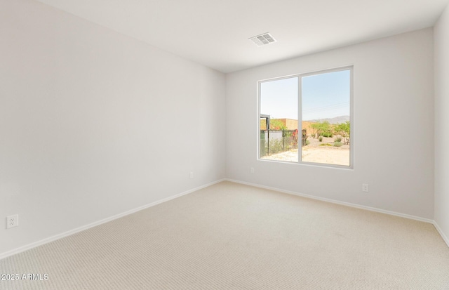 26995 W Adam Ave, Buckeye, AZ 85396 - spare room with light colored carpet and baseboards