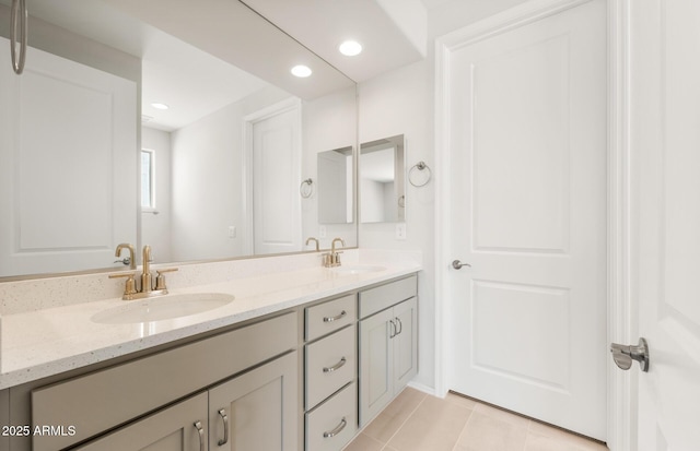 26995 W Adam Ave, Buckeye, AZ 85396 - bathroom featuring double vanity, tile patterned floors, and recessed lighting