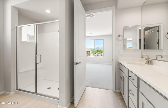 26995 W Adam Ave, Buckeye, AZ 85396 - bathroom featuring vanity, a shower stall, baseboards, tile patterned flooring, and recessed lighting