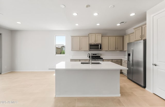 26995 W Adam Ave, Buckeye, AZ 85396 - kitchen featuring appliances with stainless steel finishes, a sink, light countertops, a center island with sink, and recessed lighting