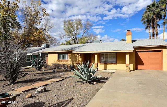 ranch-style home with a garage