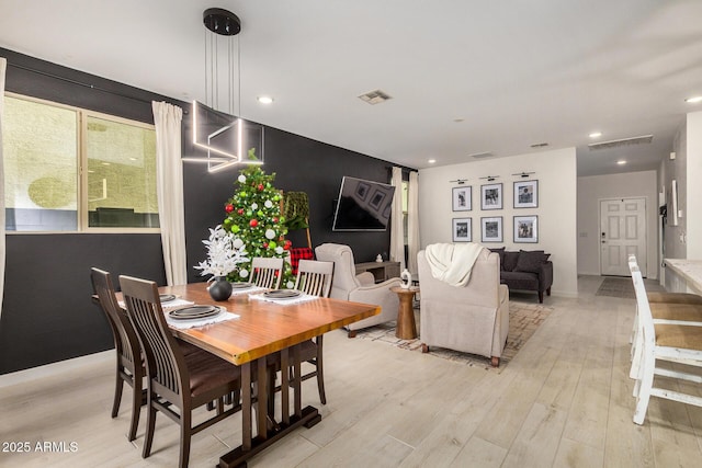 dining room with light wood-type flooring