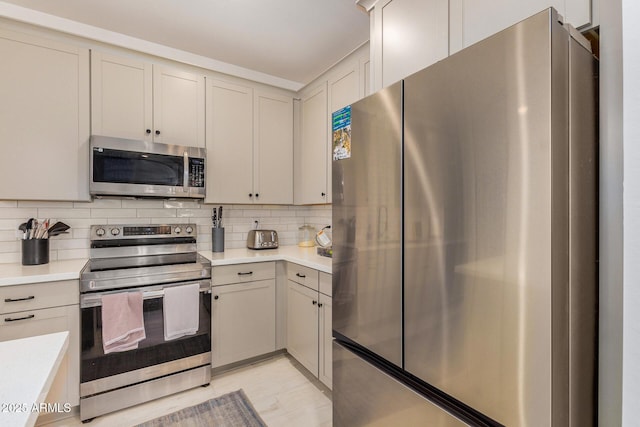 kitchen featuring backsplash and stainless steel appliances