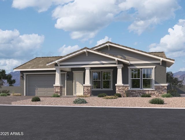 craftsman house with a garage, stone siding, decorative driveway, and stucco siding