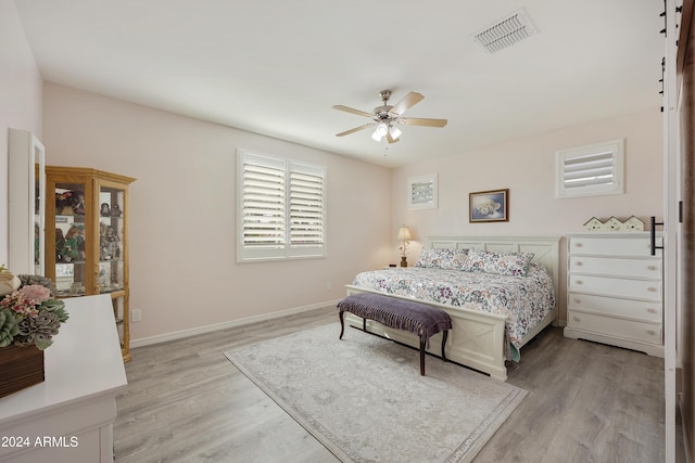 bedroom featuring ceiling fan and light hardwood / wood-style flooring