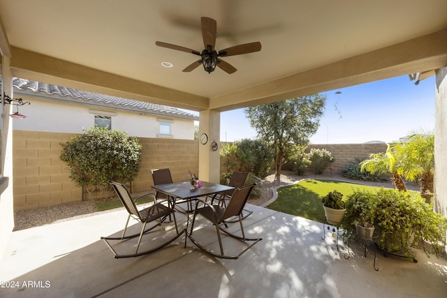 view of patio featuring ceiling fan