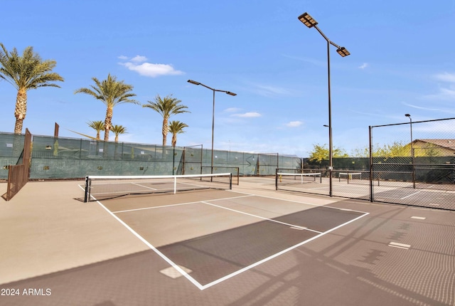 view of sport court featuring basketball hoop