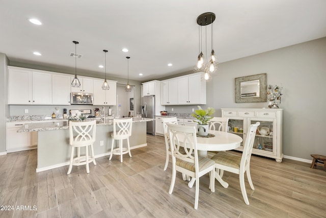 dining room featuring light wood-type flooring