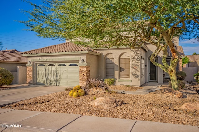 view of front of property with a garage