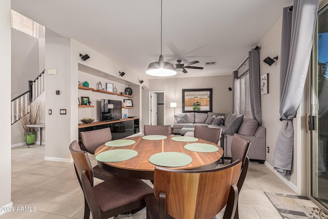 dining room with ceiling fan and light tile patterned floors