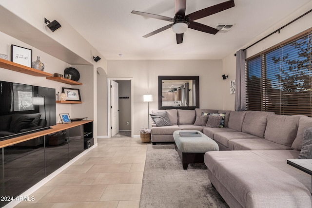 living room featuring ceiling fan and light tile patterned floors