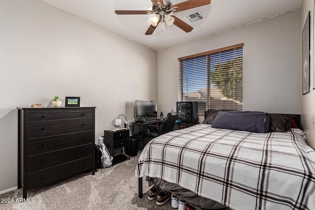 carpeted bedroom with ceiling fan and lofted ceiling