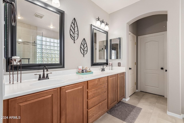 bathroom featuring tile patterned flooring and vanity