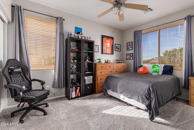 carpeted bedroom featuring ceiling fan