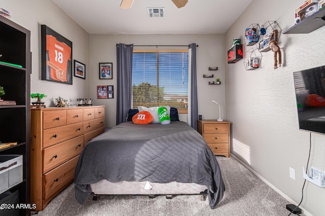 carpeted bedroom with ceiling fan