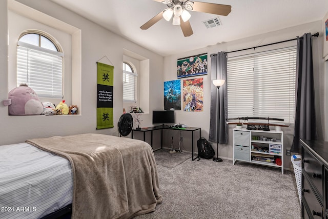 carpeted bedroom with ceiling fan