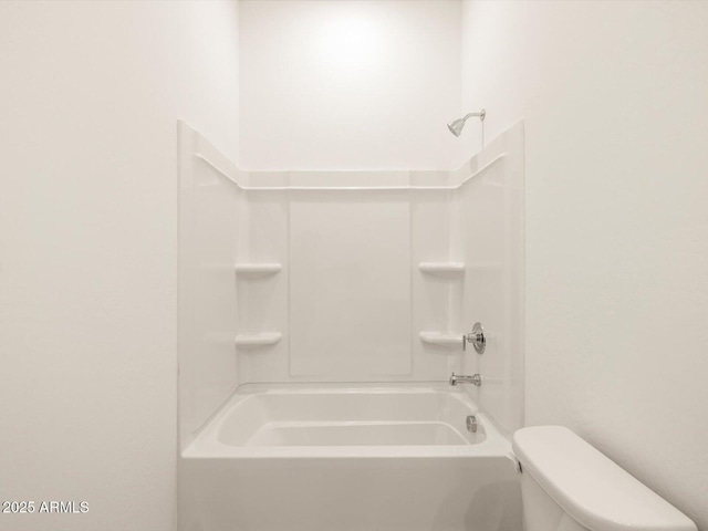 bathroom with shower / bathtub combination and toilet