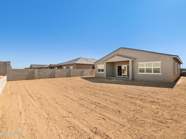 back of property featuring a patio