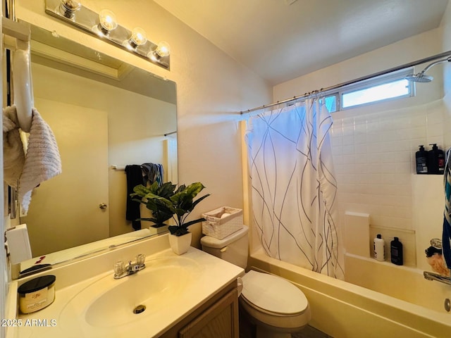 full bathroom featuring vanity, shower / tub combo, and toilet