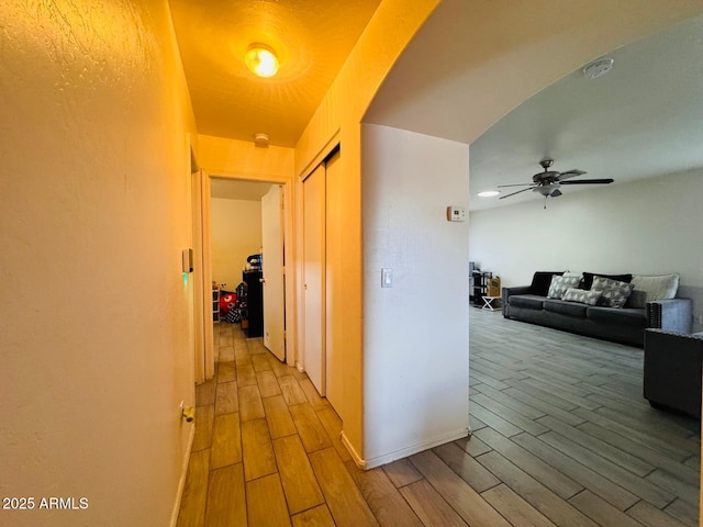 corridor with wood finish floors