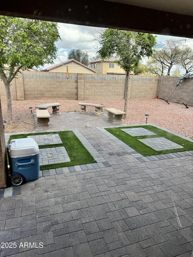 view of yard with a patio and a fenced backyard