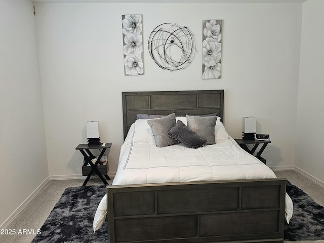 carpeted bedroom featuring baseboards