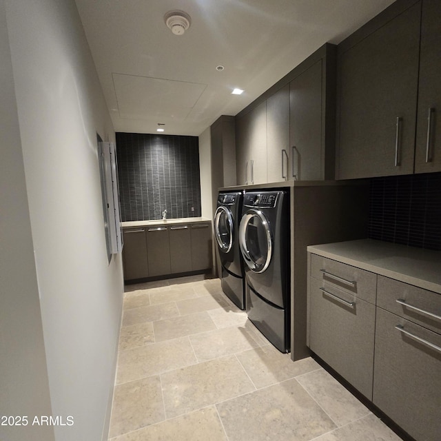 6587 N Palmeraie Blvd Unit 2022, Paradise Valley, AZ 85253 - laundry area featuring cabinet space, washer and clothes dryer, and stone tile flooring