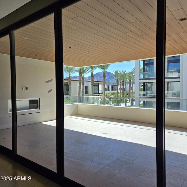 6587 N Palmeraie Blvd Unit 2022, Paradise Valley, AZ 85253 - entryway featuring plenty of natural light, a mountain view, and wood ceiling