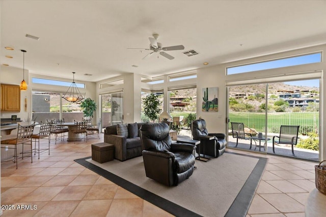 9432 N Longfeather, Fountain Hills, AZ 85268 - living room featuring light tile patterned floors, ceiling fan, and plenty of natural light