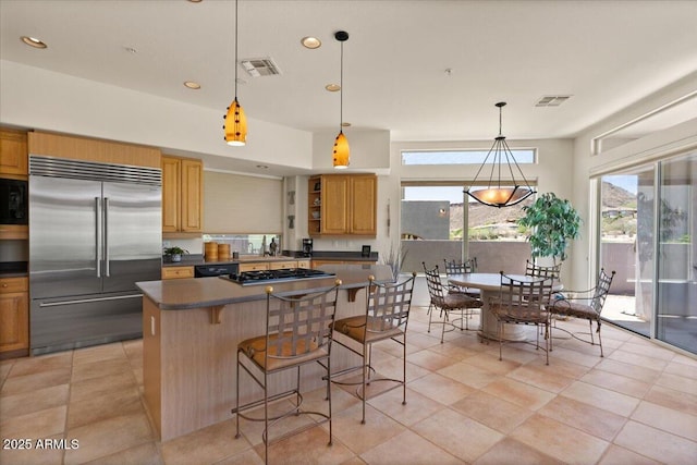 9432 N Longfeather, Fountain Hills, AZ 85268 - kitchen with black appliances, dark countertops, a kitchen island, open shelves, and a breakfast bar