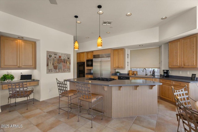 9432 N Longfeather, Fountain Hills, AZ 85268 - kitchen with black appliances, a sink, a breakfast bar, dark countertops, and a kitchen island