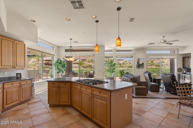 9432 N Longfeather, Fountain Hills, AZ 85268 - kitchen featuring dark countertops, light tile patterned floors, a kitchen island, open floor plan, and recessed lighting