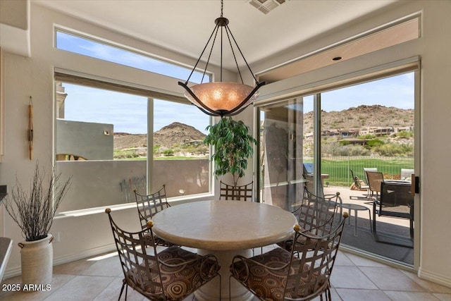 9432 N Longfeather, Fountain Hills, AZ 85268 - dining area featuring a mountain view, plenty of natural light, and light tile patterned floors