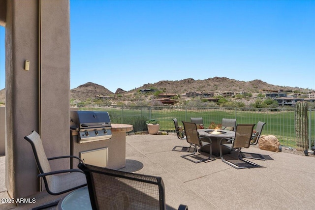 9432 N Longfeather, Fountain Hills, AZ 85268 - view of patio / terrace featuring an outdoor fire pit, a mountain view, grilling area, and area for grilling