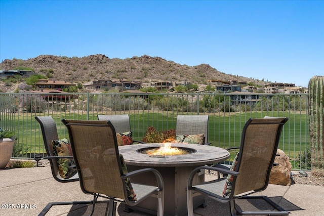 9432 N Longfeather, Fountain Hills, AZ 85268 - view of patio featuring a mountain view and an outdoor fire pit