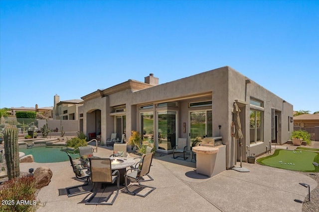 9432 N Longfeather, Fountain Hills, AZ 85268 - view of patio / terrace with an area to practice putting and fence