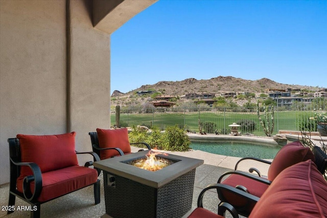9432 N Longfeather, Fountain Hills, AZ 85268 - view of patio / terrace featuring a mountain view, an outdoor fire pit, and a fenced backyard