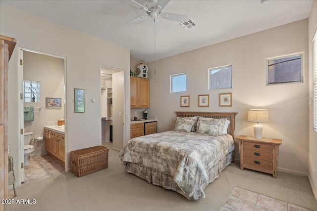 9432 N Longfeather, Fountain Hills, AZ 85268 - bedroom with light carpet, a walk in closet, a closet, connected bathroom, and ceiling fan